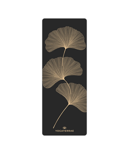 Design YinYang et feuilles de Ginkgo Biloba dorées sur tapis de yoga noir antidérapant Yogaterrae, surface technique en polyuréthane